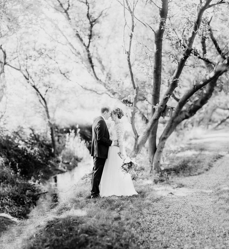 Portrait of bride and groom outdoors