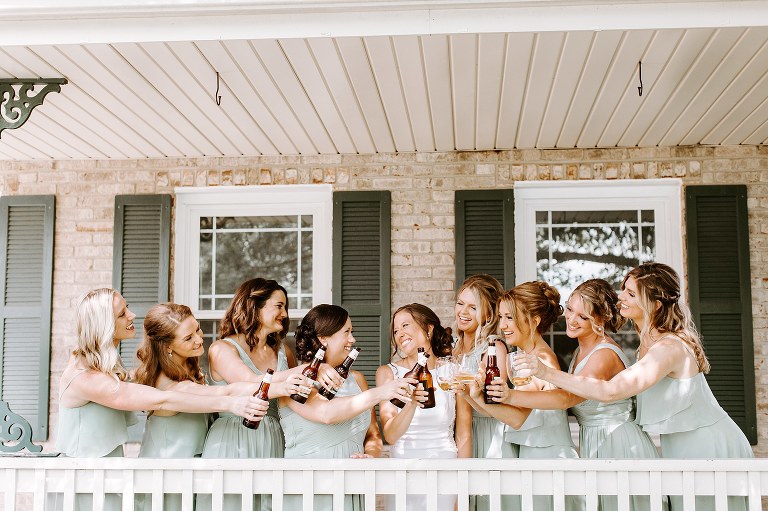 Bride and bridesmaids cheer together