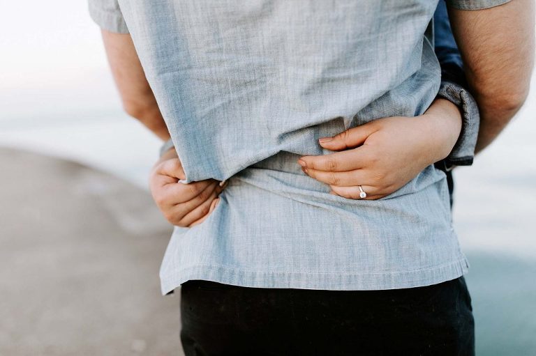 hands clutching shirt
