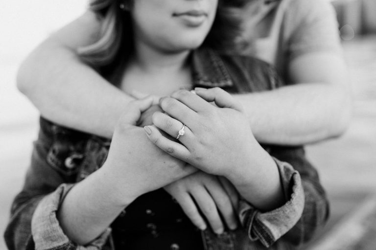Hugging showing engagement ring