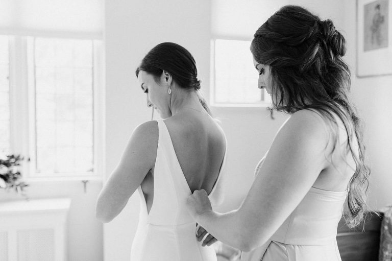 Zipping up wedding dress